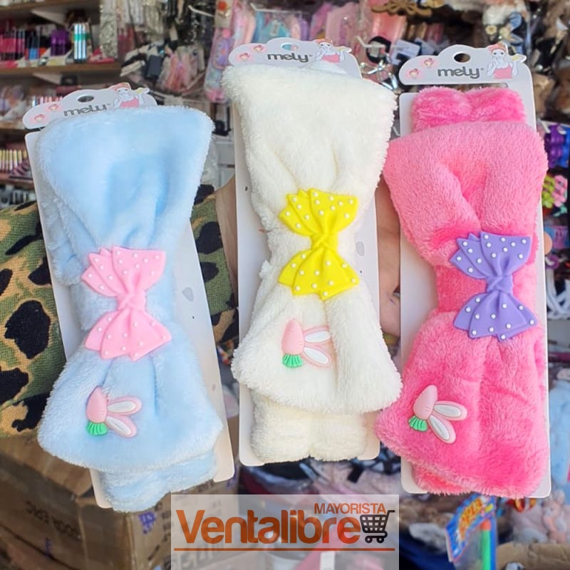 VINCHA ELÁSTICA PELUCHE CON MOÑO COLOR Y LUNARCITOS