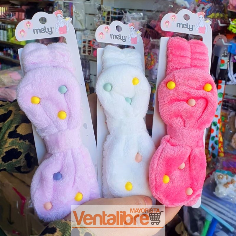 VINCHA ELÁSTICA PELUCHE CON MOÑO PUNTITOS