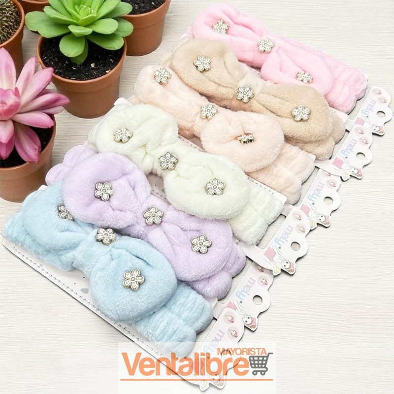 VINCHA ELÁSTICA PELUCHE CON MOÑO FLOR