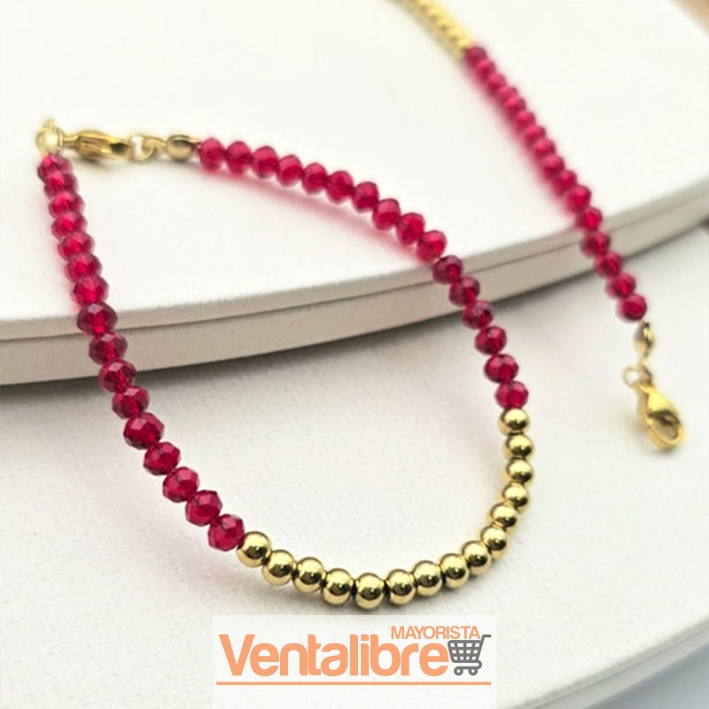 PULSERA DE ACERO DORADO CON CRISTALES ROJOS Y BOLITAS 18 CM.