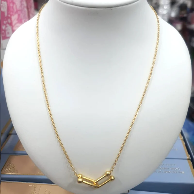 CADENA ACERO QUIRÚRGICO DORADO 45 CM. CON DIJE ENTRELAZADO