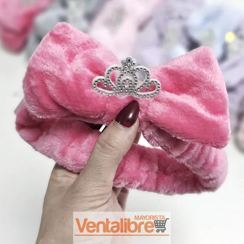 VINCHA ELÁSTICA PELUCHE CON MOÑO CORONITA