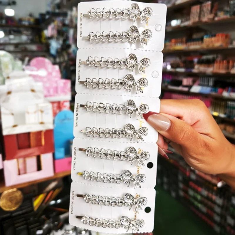 BLISTER X 2 HEBILLAS MARIPOSAS CON PIEDRAS Y STRASS